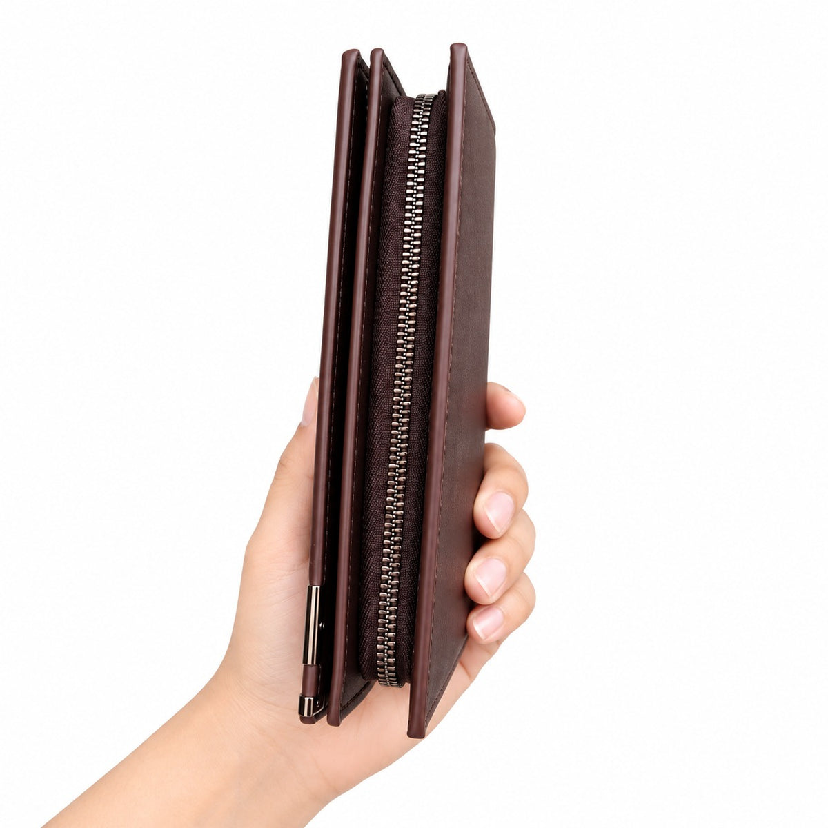A hand holding a slim, dark brown leather zip-around wallet or card holder against a plain white background.
