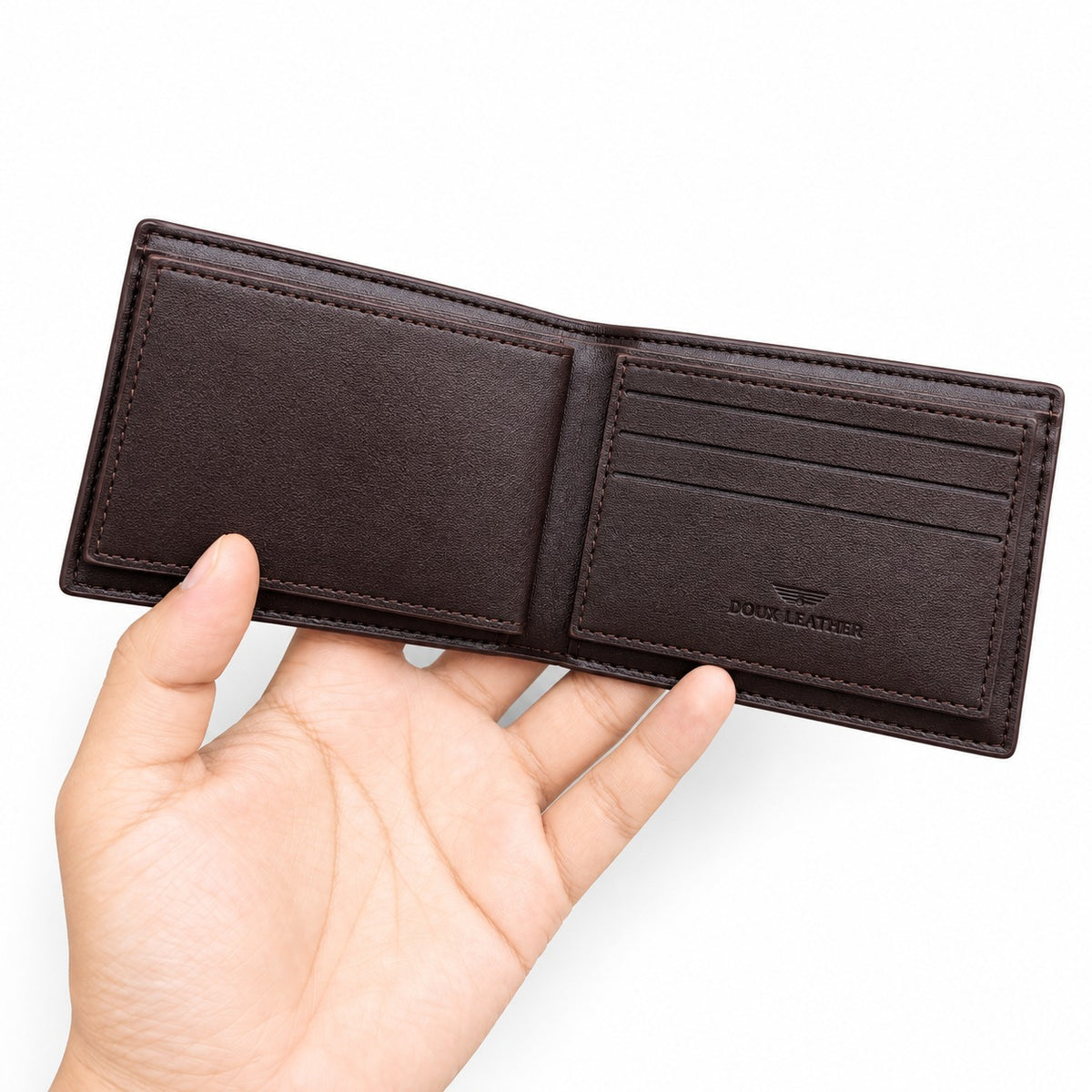 A dark brown leather bi-fold wallet held open by a hand against a plain white background. The wallet is shown from the inside, displaying two card slots, a central divider, and an embossed logo that reads DOOR LEATHER.